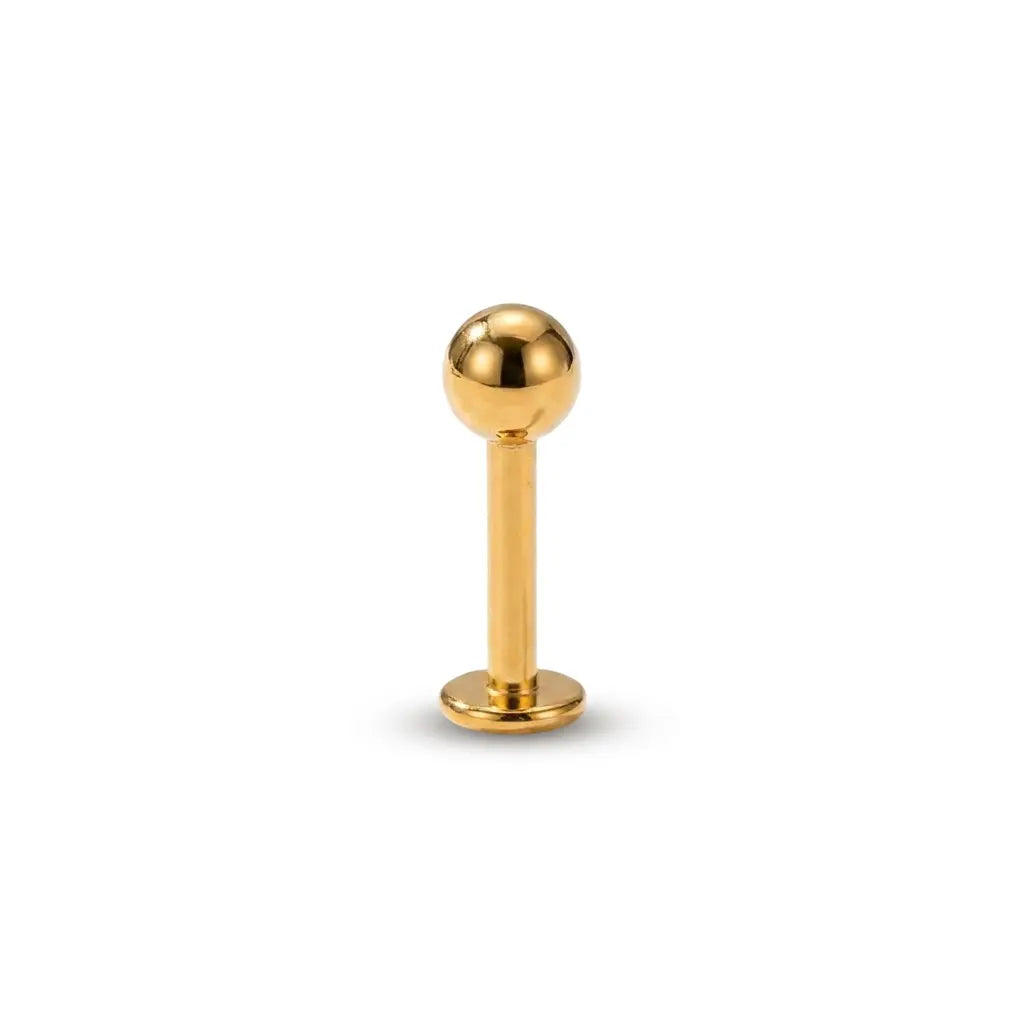 Gold ball-shaped earring on a white background