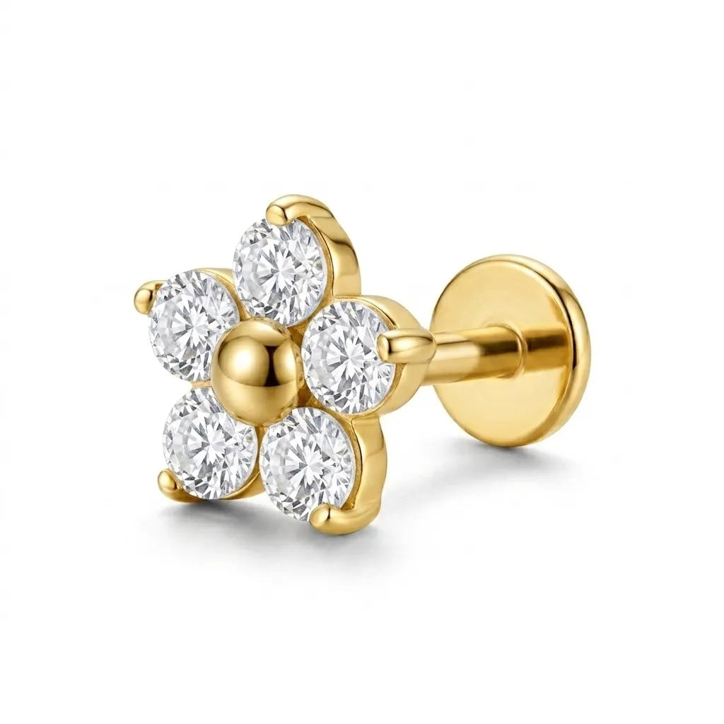 A single gold flower-shaped stud earring with five clear round-cut gemstones, shown on a clean white background.