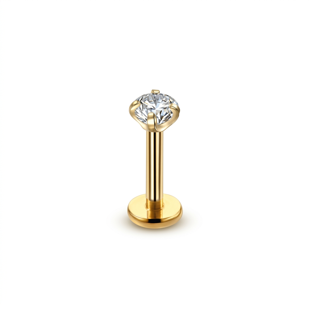 Gold stud earring with a clear gemstone on a white background