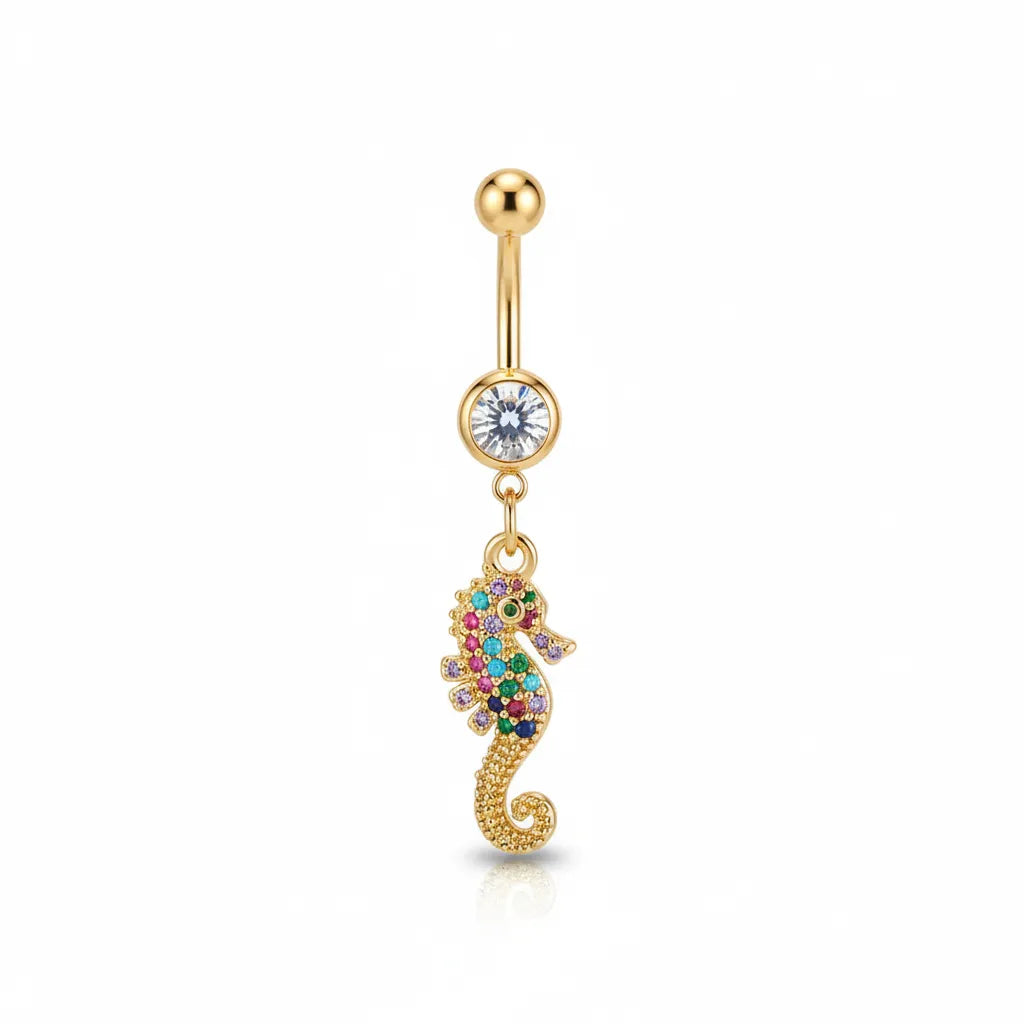 Gold belly button ring with a colorful seahorse charm on a white background