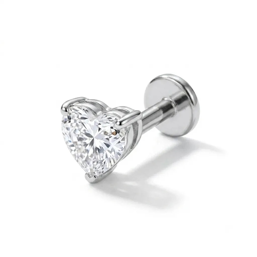 Heart-shaped diamond stud earring on a white background