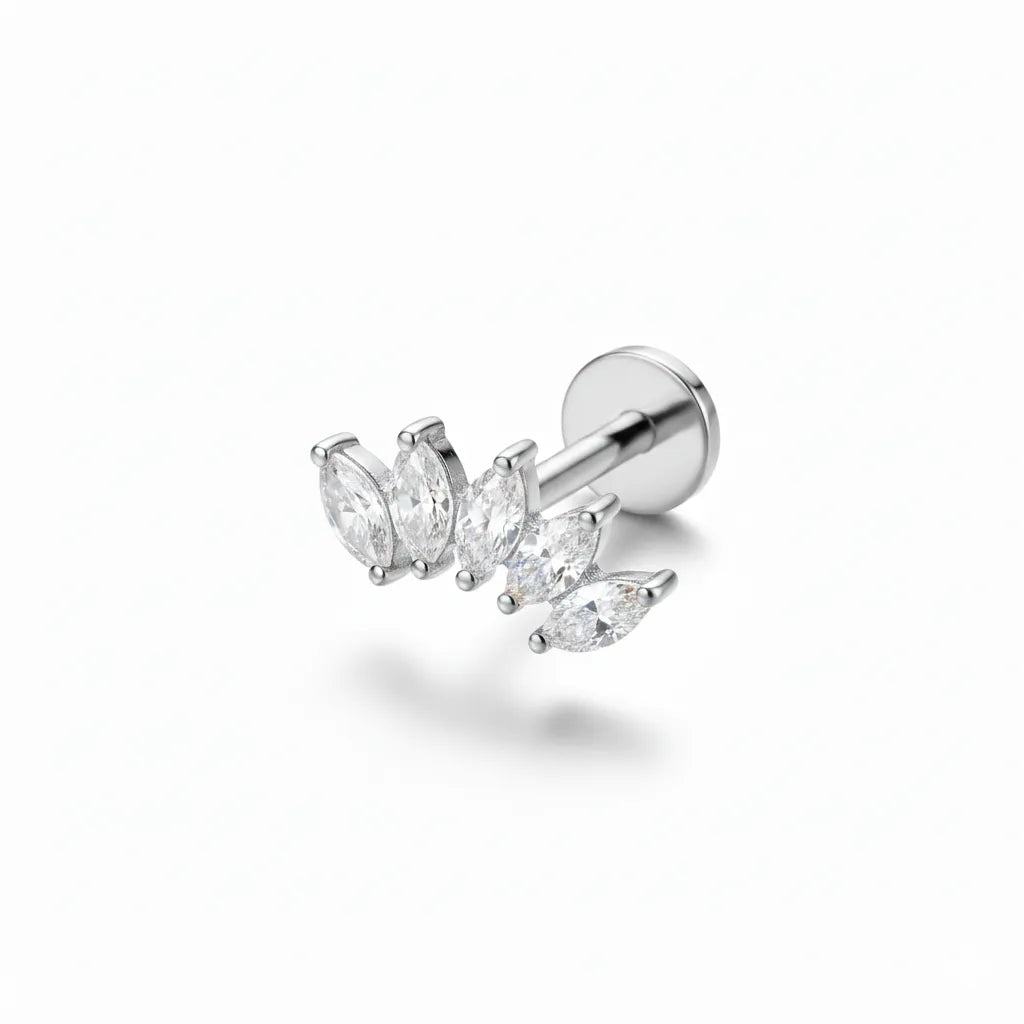 Single earring with clear gemstones on a white background