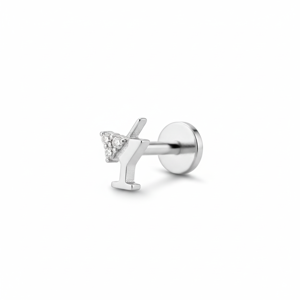 Silver stud earring with a small diamond on a white background