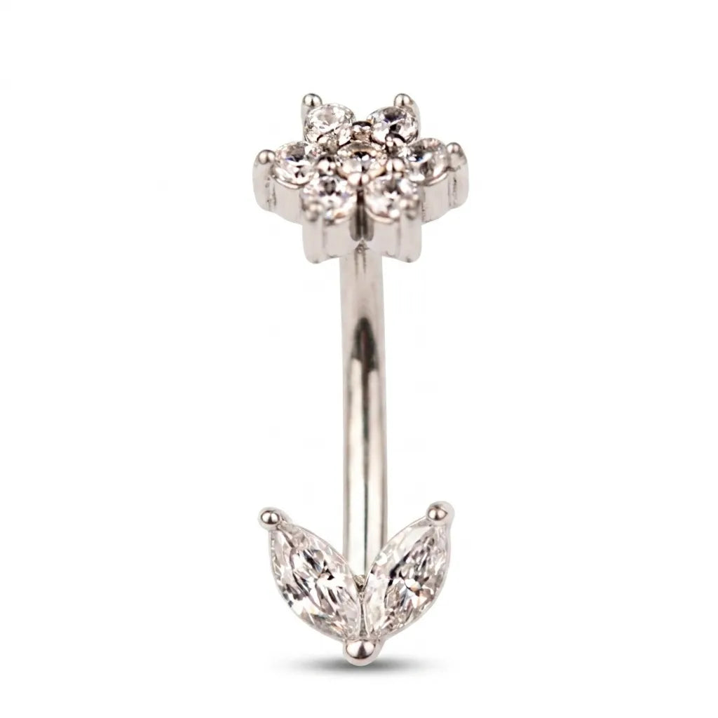 Silver belly button ring with floral design on a white background
