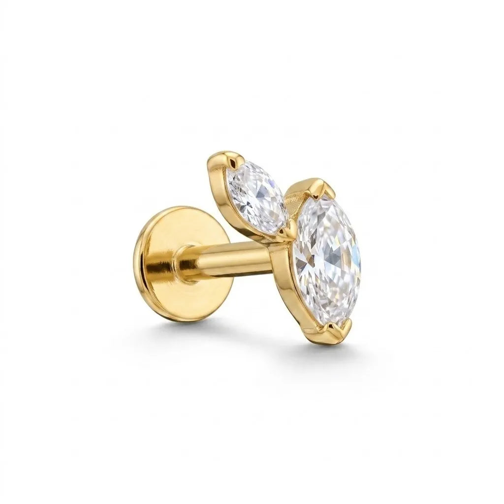 A gold stud earring featuring marquise-cut clear gemstones in a prong setting, shown from a side angle on a clean white background.