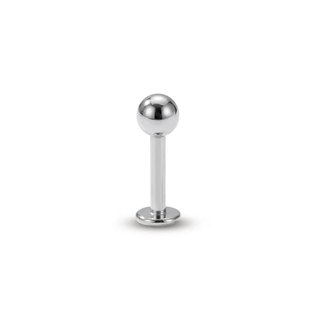 Silver ball-shaped lip ring on a white background