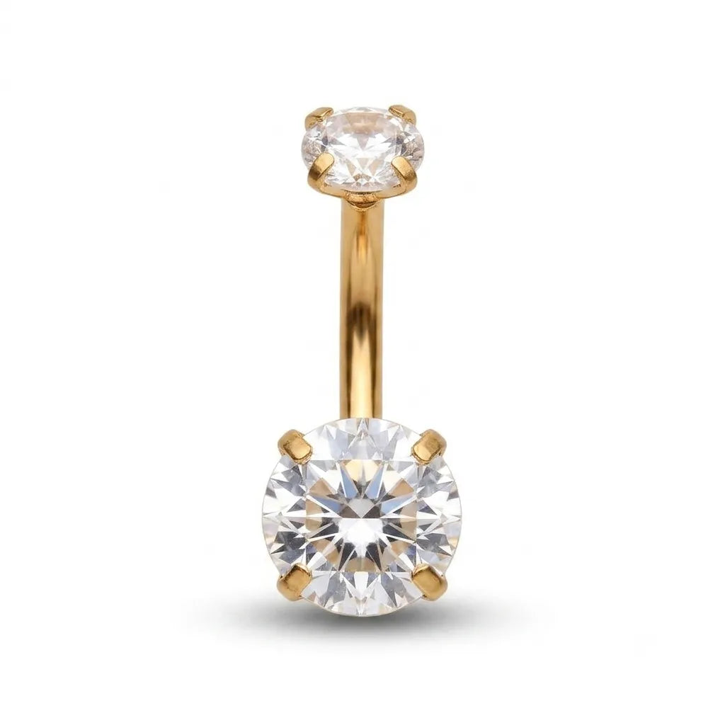 Gold belly button ring with clear gemstones on a white background