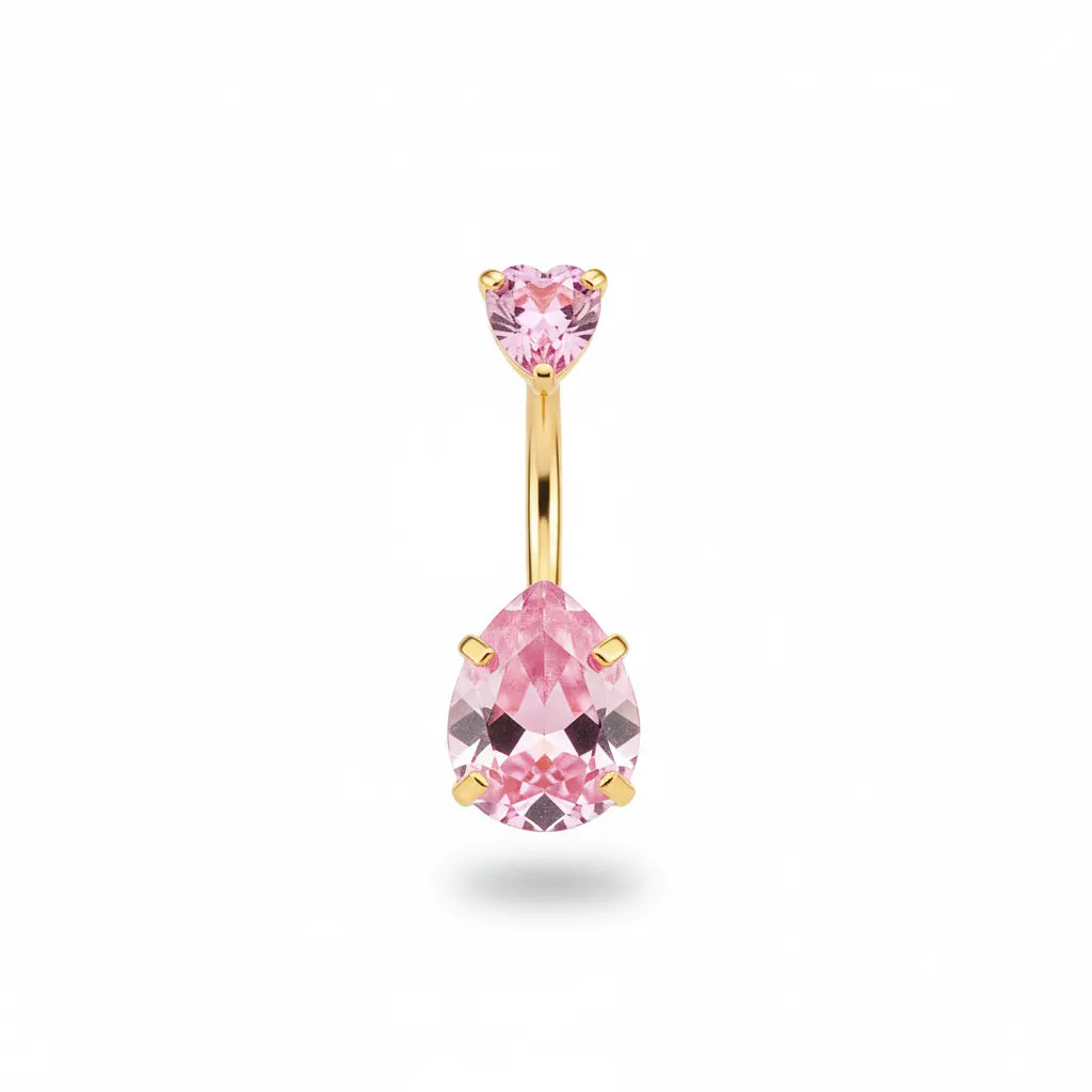 Gold belly button ring with pink gemstones on a white background