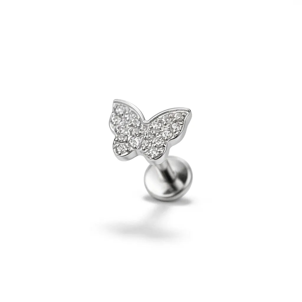 Butterfly tragus earring on a white background