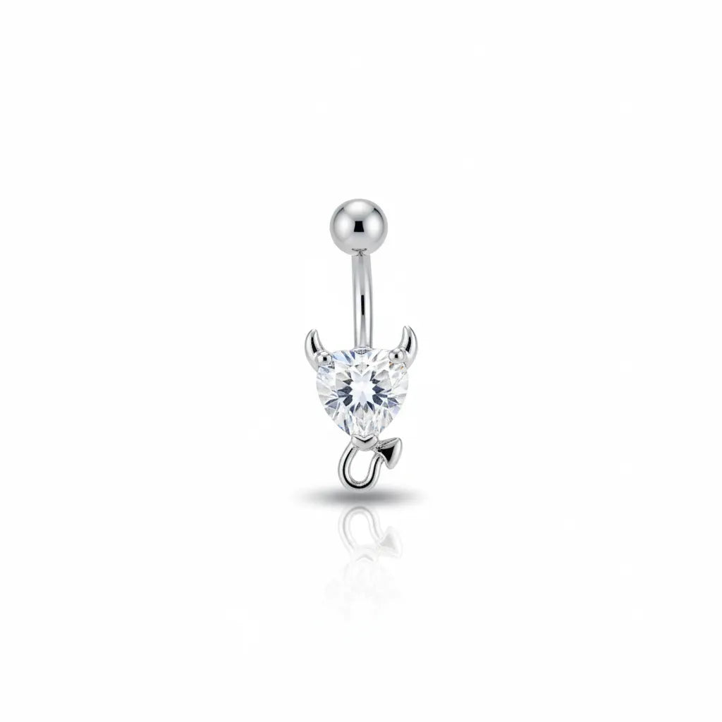 Silver belly button ring with a heart-shaped gem on a white background