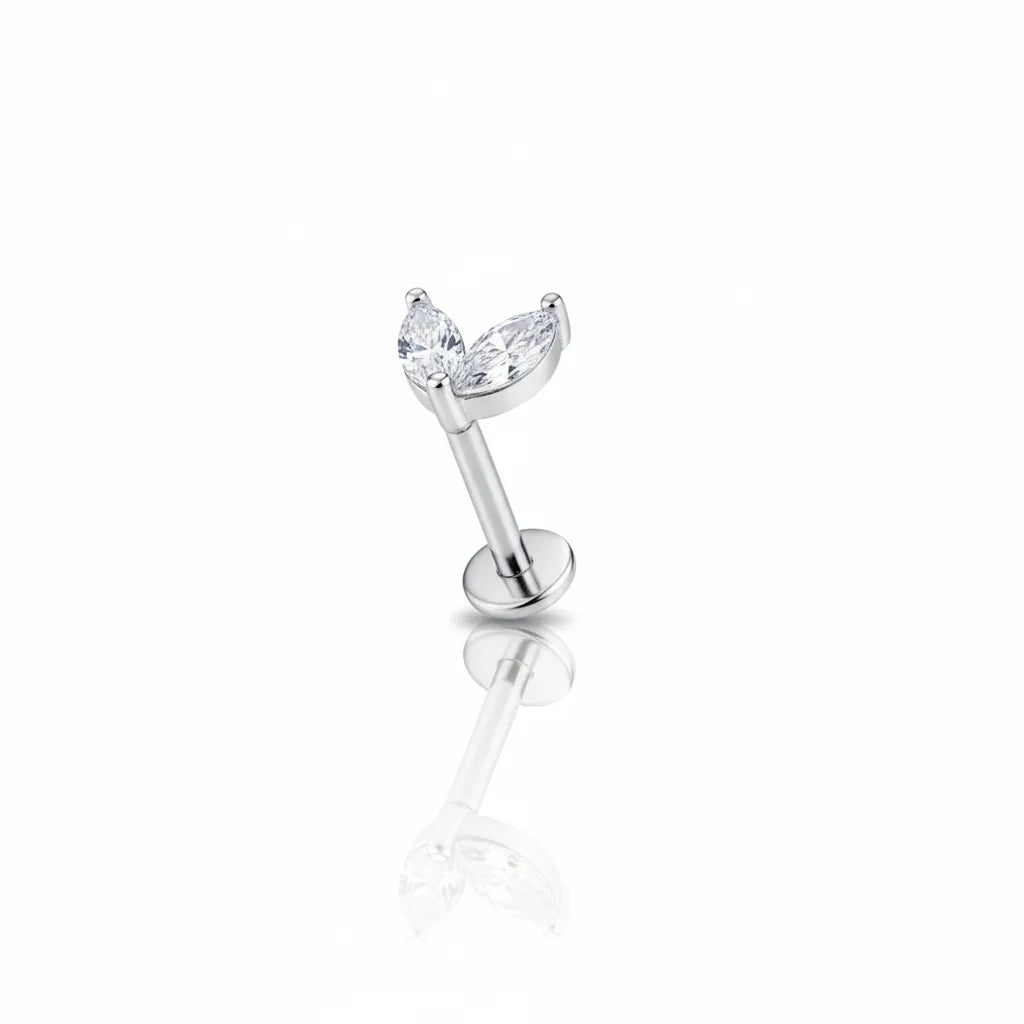 Silver stud earring with a clear gemstone on a white background