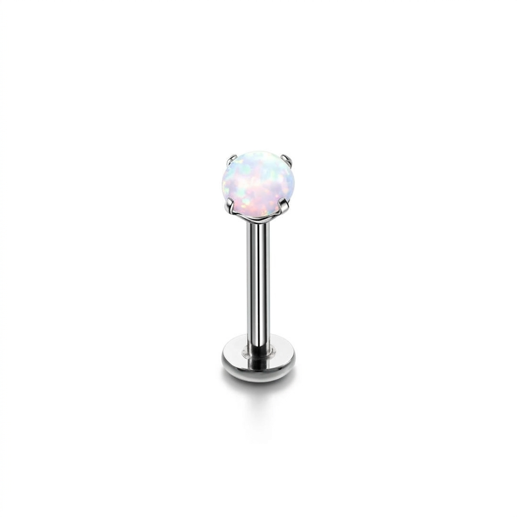 Silver lip ring with a clear gemstone on a white background