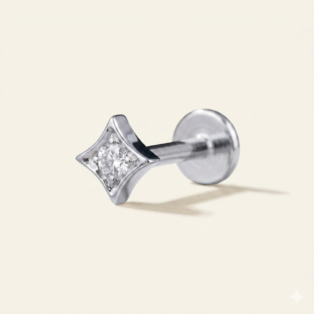 Silver implant grade titanium star labret stud with cubic zirconia centre stone on white background