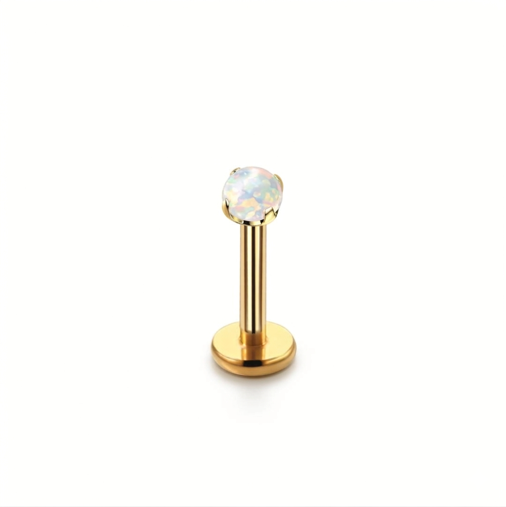 Gold necklace with a round pendant on a white background