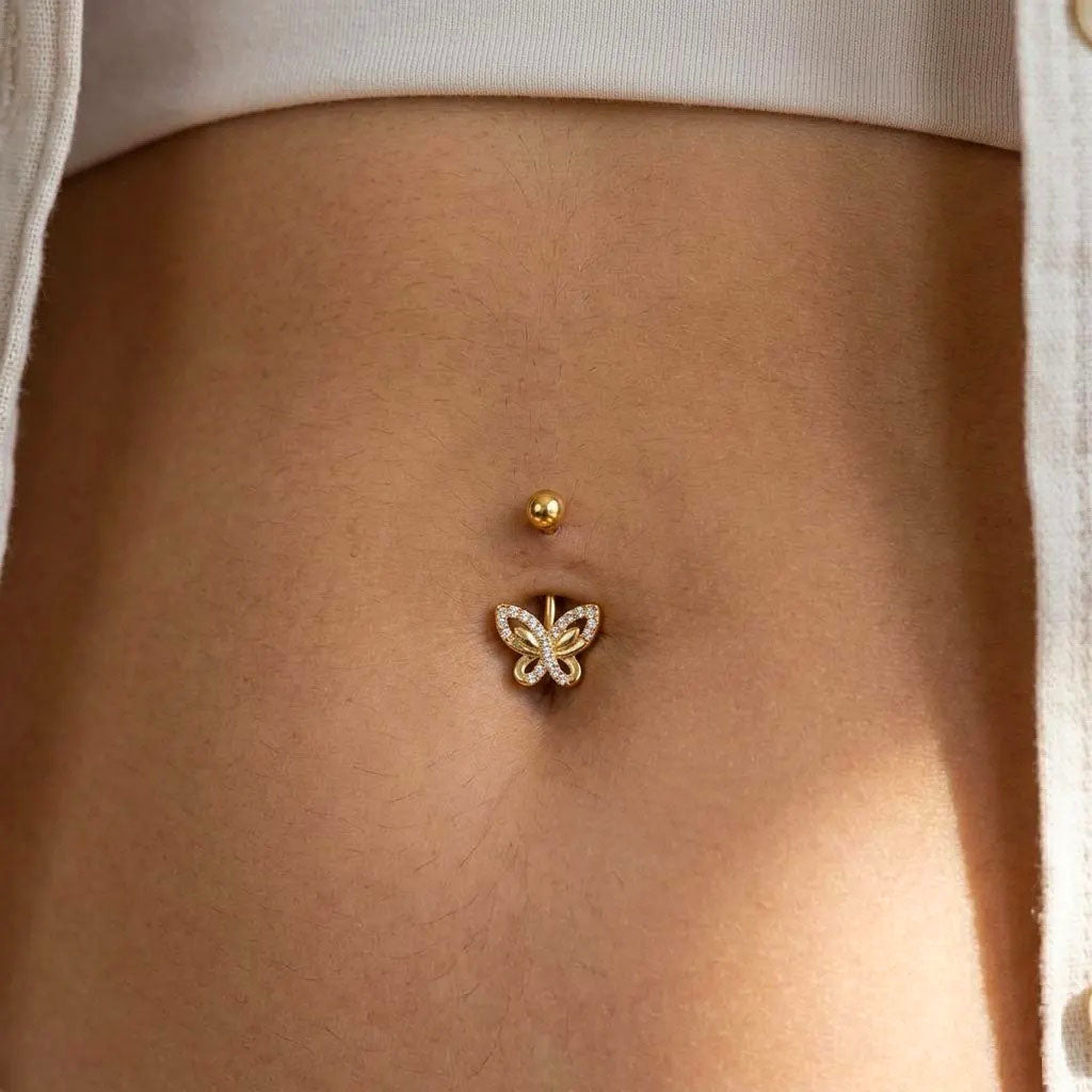 Butterfly belly button ring on a person's stomach