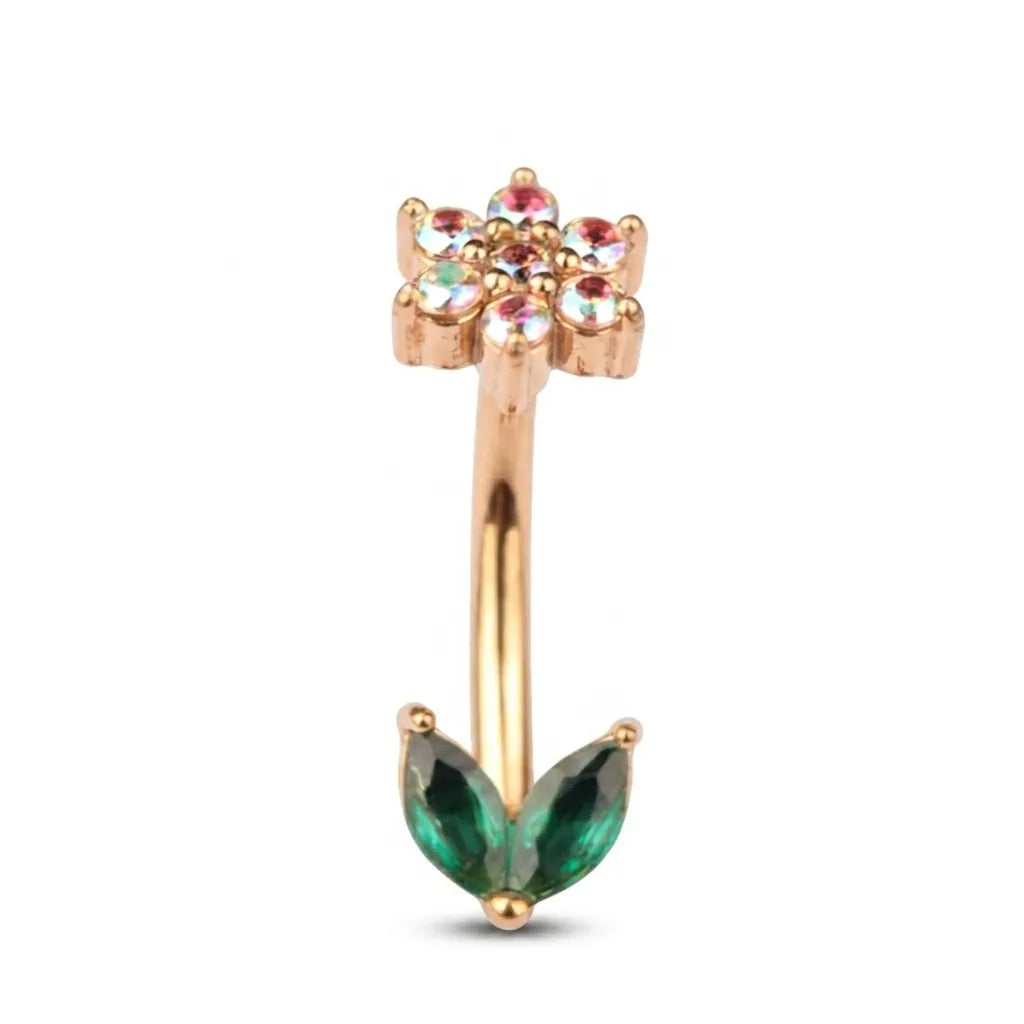 Gold nose ring with green gemstone on a white background
