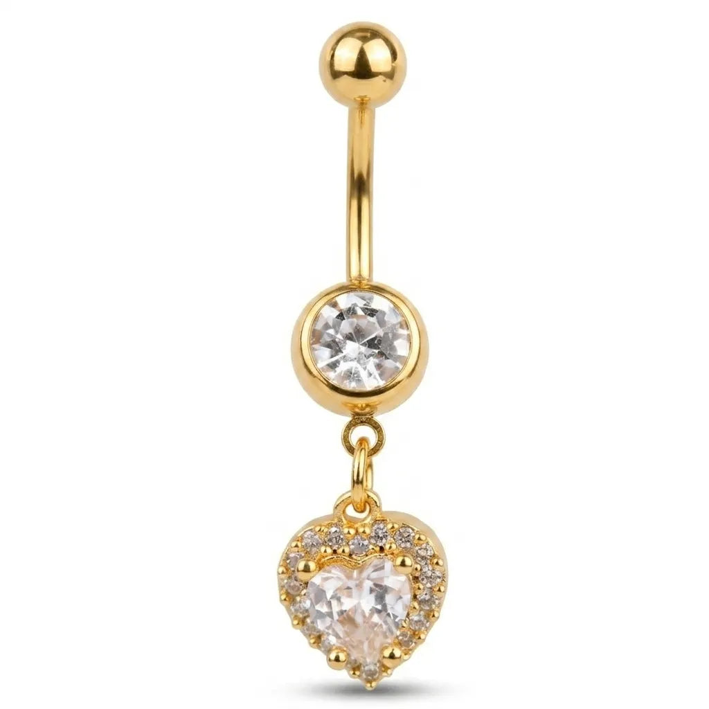 Gold belly button ring with heart-shaped pendant and clear gemstone on a white background