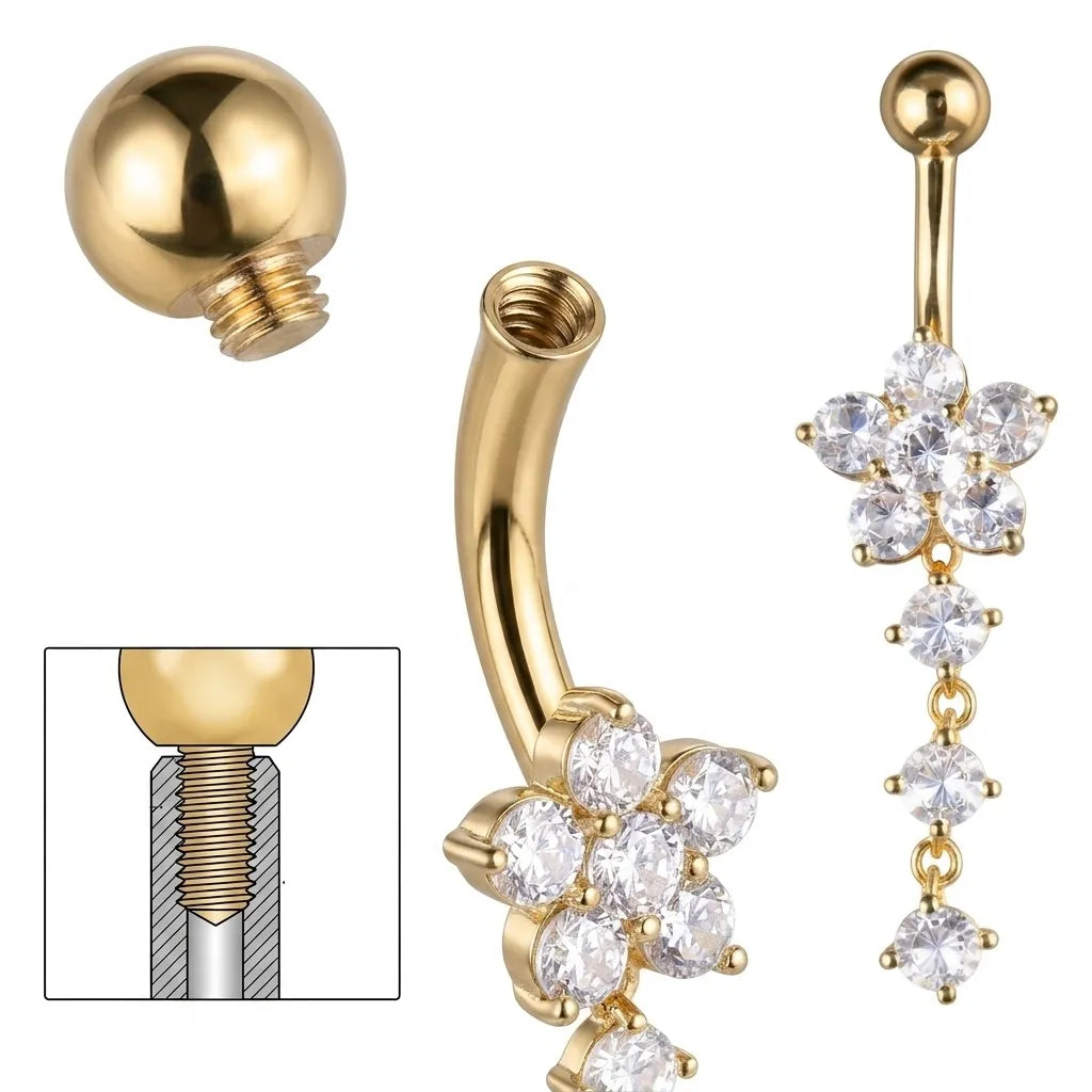 Gold belly button ring with clear gemstones on a white background