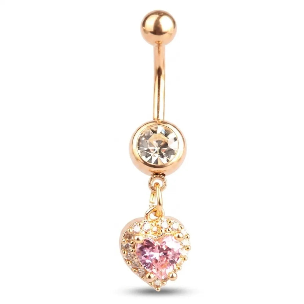 Gold belly button ring with a pink heart charm on a white background
