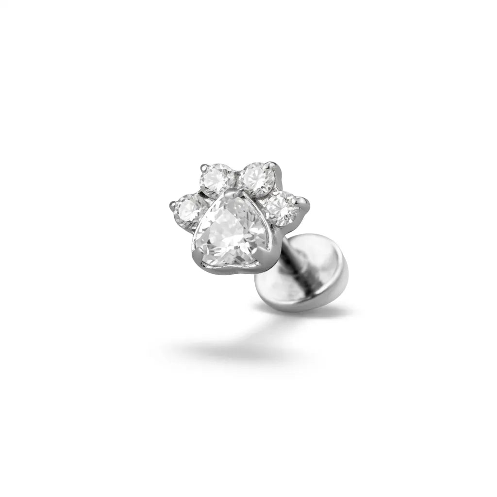 Silver tragus piercing on a white background