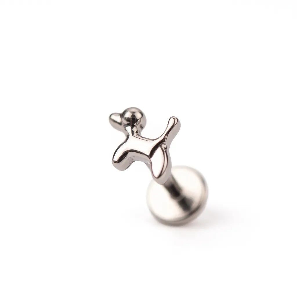 Silver tragus earring on a white background