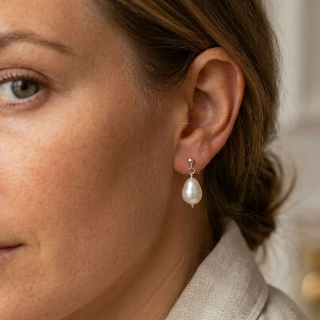 Vita Perlata silver pearl drop earrings worn on model, showing drop length and baroque pearl size